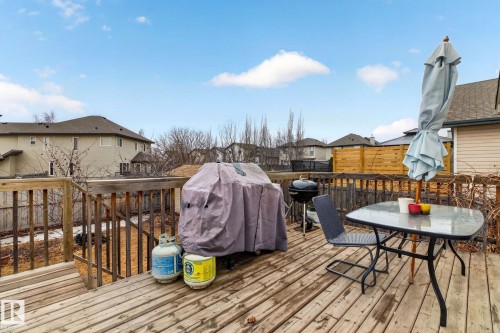 The property features a wooden deck with a protective railing - 20147 48 Avenue, Edmonton, AB - Outdoor With Deck Patio Veranda With Exterior