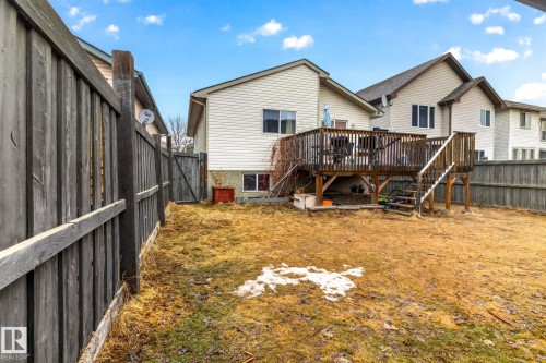 The property features a fenced yard with a wooden deck and exterior stairs - 20147 48 Avenue, Edmonton, AB - Outdoor With Deck Patio Veranda With Exterior