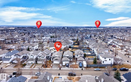 Aerial view of the neighborhood showcasing a residential street with detached properties, each featuring a private driveway and attached garage - 20147 48 Avenue, Edmonton, AB - Outdoor With View