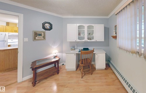 This room features light-colored flooring, light blue walls, and white trim - 31 9914 80 Avenue, Edmonton, AB - Indoor Photo Showing Other Room
