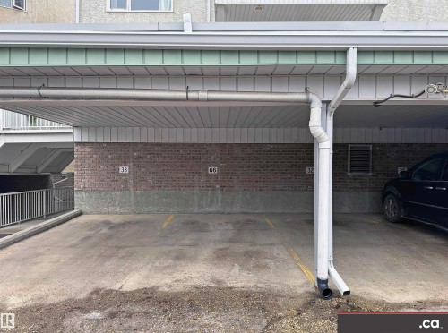 The property features a concrete parking area with designated parking spaces - 31 9914 80 Avenue, Edmonton, AB - 