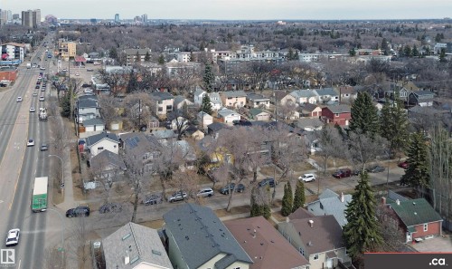 Aerial view of a residential neighborhood with a tree-lined street and varying rooflines - 31 9914 80 Avenue, Edmonton, AB - Outdoor With View