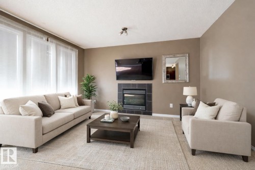 3617 Whitelaw Bay, Edmonton, AB - Indoor Photo Showing Living Room With Fireplace