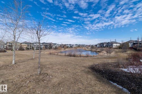 This property offers scenic views of a pond with surrounding natural vegetation - 1403 Cunningham Drive, Edmonton, AB - Outdoor With View