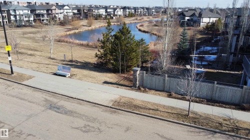 Community with a pond feature and a paved walking path - 1403 Cunningham Drive, Edmonton, AB - Outdoor
