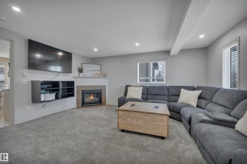 130 Campbell Road, Leduc, AB - Indoor Photo Showing Living Room With Fireplace