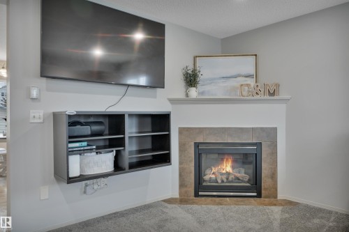 130 Campbell Road, Leduc, AB - Indoor Photo Showing Living Room With Fireplace