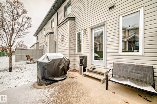 The property features a private patio area with access to a yard - 8 13838 166Ave, Edmonton, AB - Outdoor