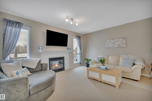 190 Keyport Circle, Leduc, AB - Indoor Photo Showing Living Room With Fireplace