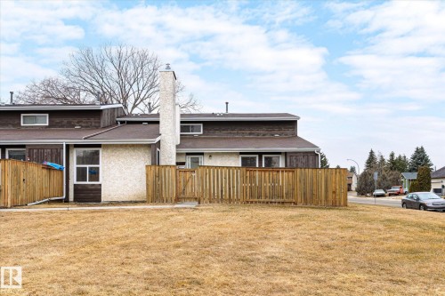 The property features a private fenced yard, a stucco exterior, and a chimney - 6540 184 Street, Edmonton, AB - Outdoor
