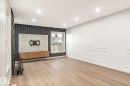 Living area featuring light wood flooring, recessed lighting, and a window providing natural light - 6540 184 Street, Edmonton, AB  - Indoor Photo Showing Other Room 