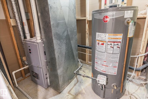 The property includes a water heater and furnace, providing essential utilities - 6540 184 Street, Edmonton, AB - Indoor Photo Showing Basement