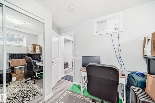 This room features light-colored walls and flooring, with a window providing natural light - 5868 Anthony Crescent, Edmonton, AB - Indoor Photo Showing Office