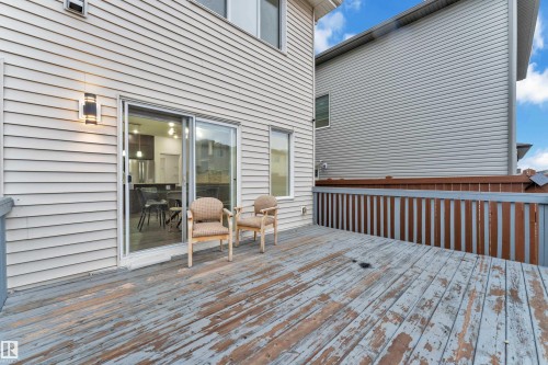 This property features an exterior deck with a wooden railing - 3235 13 Avenue, Edmonton, AB - Outdoor With Deck Patio Veranda With Exterior