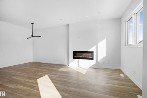 1227 Cristall Way, Edmonton, AB - Indoor Photo Showing Other Room With Fireplace
