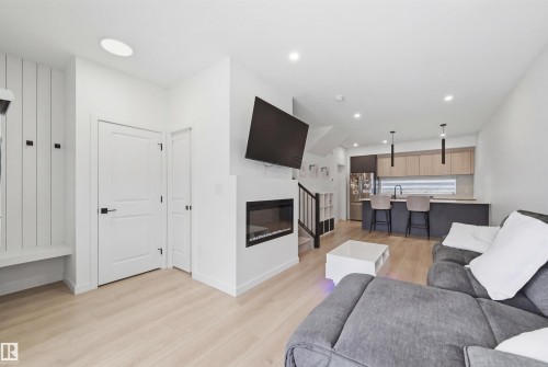 3 12204 121 Avenue, Edmonton, AB - Indoor Photo Showing Living Room With Fireplace