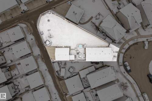 Aerial view of the property, featuring two structures, a snow-covered yard, and a hot tub - 635 41 Avenue, Edmonton, AB -  With View