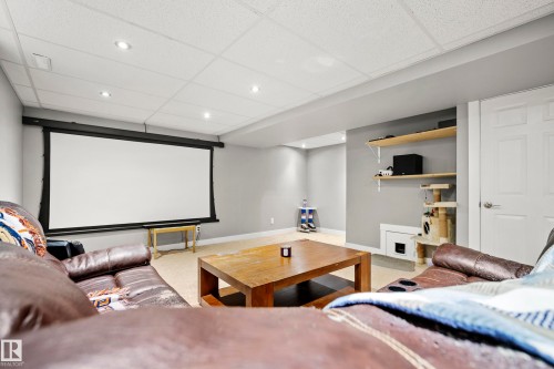 Entertainment room featuring a ceiling with recessed lighting, carpeted flooring, and a large projection screen - 635 41 Avenue, Edmonton, AB - Indoor Photo Showing Other Room
