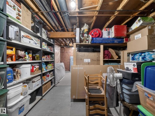 The property includes a utility area with exposed ceiling joists and visible ductwork - 7 85 Gervais Road, St. Albert, AB - Indoor Photo Showing Other Room