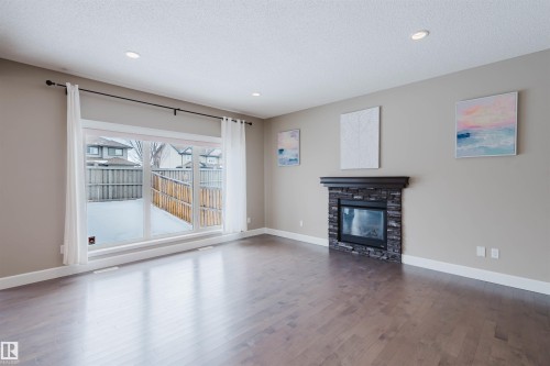 1957 Ainslie Link, Edmonton, AB - Indoor Photo Showing Living Room With Fireplace