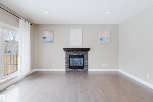 1957 Ainslie Link, Edmonton, AB - Indoor Photo Showing Living Room With Fireplace