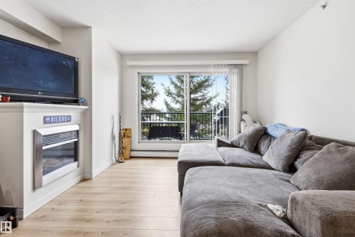 413 17003 67 Avenue, Edmonton, AB - Indoor Photo Showing Living Room With Fireplace