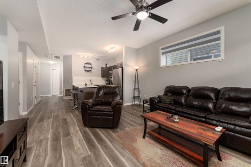 23 6520 2 Avenue, Edmonton, AB - Indoor Photo Showing Living Room