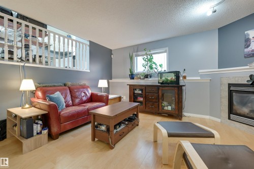 5811 Sutter Place, Edmonton, AB - Indoor Photo Showing Living Room With Fireplace