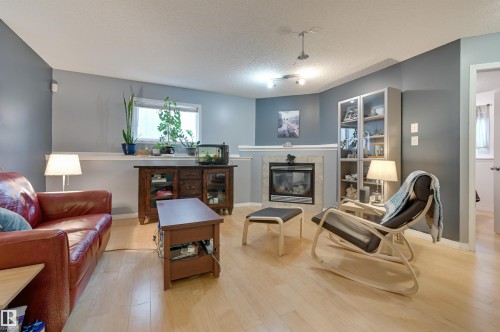5811 Sutter Place, Edmonton, AB - Indoor Photo Showing Living Room With Fireplace