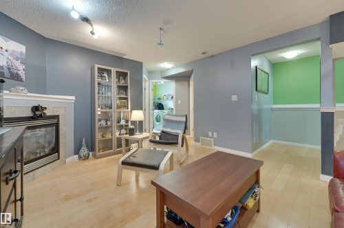 5811 Sutter Place, Edmonton, AB - Indoor Photo Showing Living Room With Fireplace