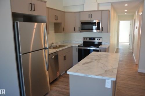 B 4313 54 Avenue, Barrhead, AB - Indoor Photo Showing Kitchen With Double Sink With Upgraded Kitchen