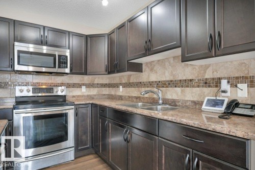 50 445 Brintnell Boulevard, Edmonton, AB - Indoor Photo Showing Kitchen With Double Sink With Upgraded Kitchen