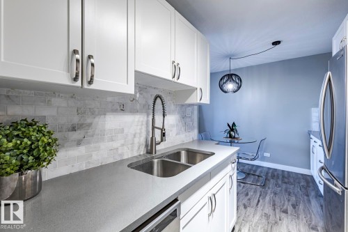 105 10883 Saskatchewan Drive, Edmonton, AB - Indoor Photo Showing Kitchen With Double Sink
