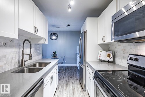105 10883 Saskatchewan Drive, Edmonton, AB - Indoor Photo Showing Kitchen With Stainless Steel Kitchen With Double Sink