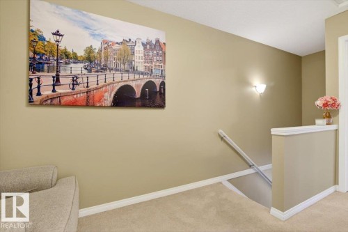 The property features neutral-toned walls, white baseboards, and a carpeted floor - 1637 Towne Centre Boulevard, Edmonton, AB - Indoor Photo Showing Other Room