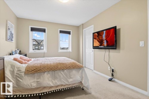 This room features two windows and light-colored carpeting - 1637 Towne Centre Boulevard, Edmonton, AB - Indoor Photo Showing Bedroom