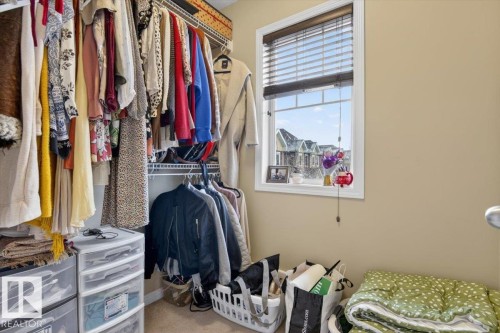 The property features a closet with wire shelving and a window with blinds providing natural light - 1637 Towne Centre Boulevard, Edmonton, AB - Indoor With Storage