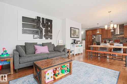 Open concept living area featuring hardwood flooring throughout - 18 Enchanted Way, St. Albert, AB 