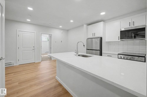 21203 25 Avenue, Edmonton, AB - Indoor Photo Showing Kitchen With Upgraded Kitchen