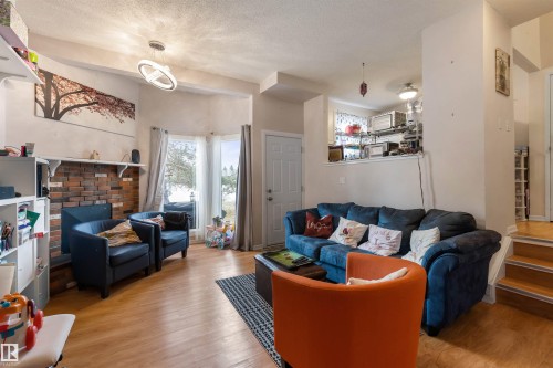 5975 40 Avenue, Edmonton, AB - Indoor Photo Showing Living Room With Fireplace