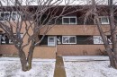 The property exterior features a two-story design, a front entrance with a white door, and several windows - 1728 37 Street, Edmonton, AB  - Outdoor 