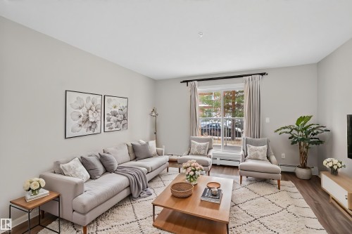 Virtually Staged - 106 4403 23 Street Nw, Edmonton, AB - Indoor Photo Showing Living Room