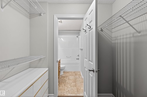 Closet leads to the cheater door to the main bathroom - 106 4403 23 Street Nw, Edmonton, AB - Indoor Photo Showing Other Room