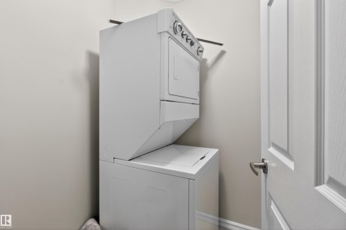 and storage - 106 4403 23 Street Nw, Edmonton, AB - Indoor Photo Showing Laundry Room