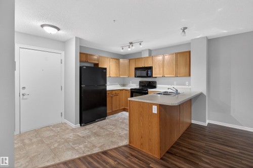 106 4403 23 Street Nw, Edmonton, AB - Indoor Photo Showing Kitchen With Double Sink