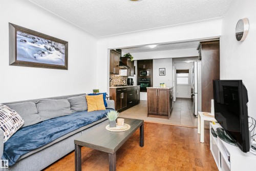 Open concept living area with hardwood flooring and recessed lighting - 6524 112 Street, Edmonton, AB - Indoor Photo Showing Living Room