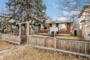 The property features a red brick exterior, a front entry with white steps and railing, and large windows - 6524 112 Street, Edmonton, AB  - Outdoor 