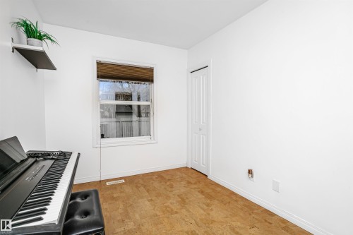 This room features light-colored flooring, white walls, and a window with blinds - 6524 112 Street, Edmonton, AB - Indoor Photo Showing Other Room