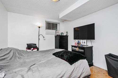 This room features white walls, a window with blinds, and recessed lighting - 6524 112 Street, Edmonton, AB - Indoor Photo Showing Bedroom