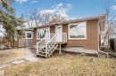 The property features a brown stucco exterior, white trim around the windows, and a white front door - 6524 112 Street, Edmonton, AB  - Outdoor 